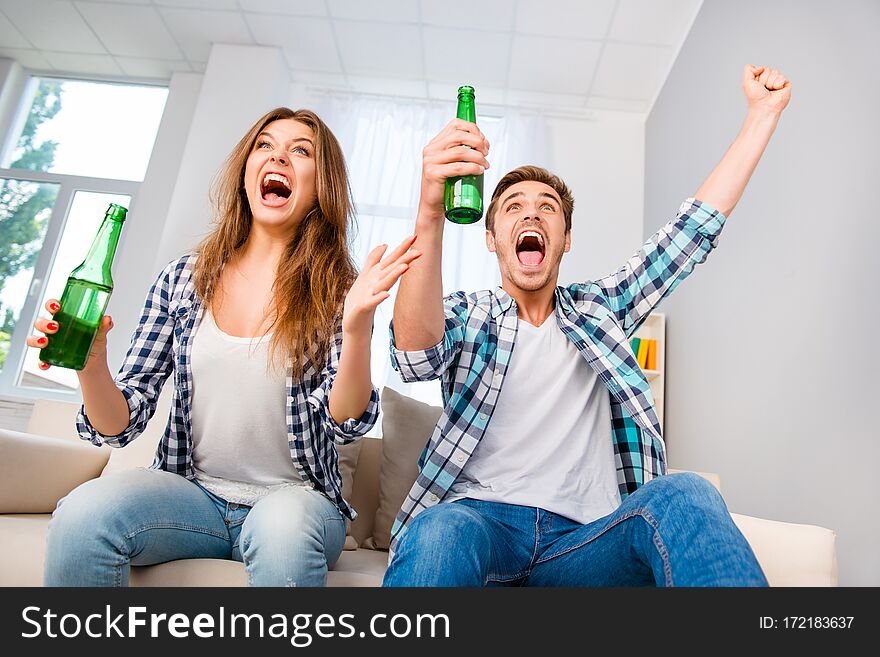 Goal! Happy Man And Woman With Beer Triumphing With Raised Hands