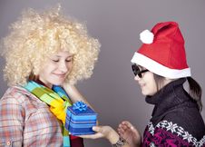 Two Beautiful Girls With Gifts In Christmas Hats Royalty Free Stock Image
