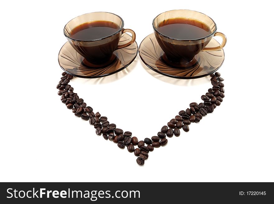 Two cups from coffee and grain in the form of heart