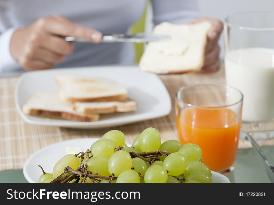 Woman enjoying her healthy breakfast. Woman enjoying her healthy breakfast