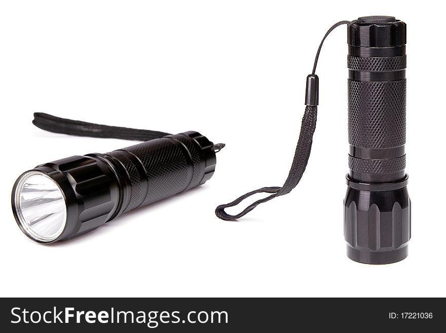 Black flashlight isolated on white