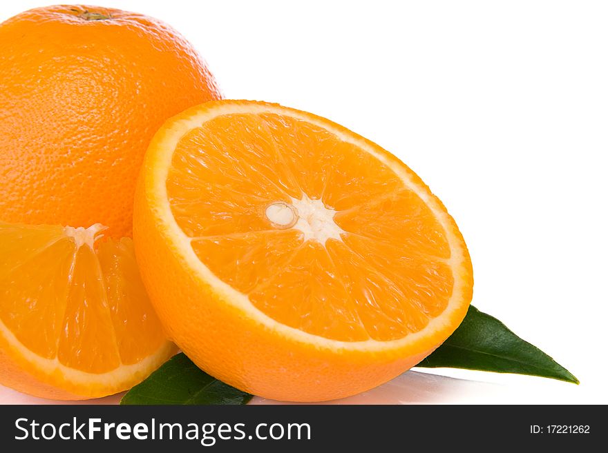 Oranges And Green Leaves  Isolated On White