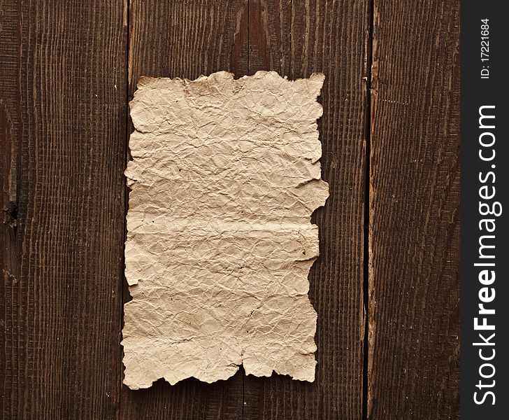 Old paper on brown wood texture with natural patterns