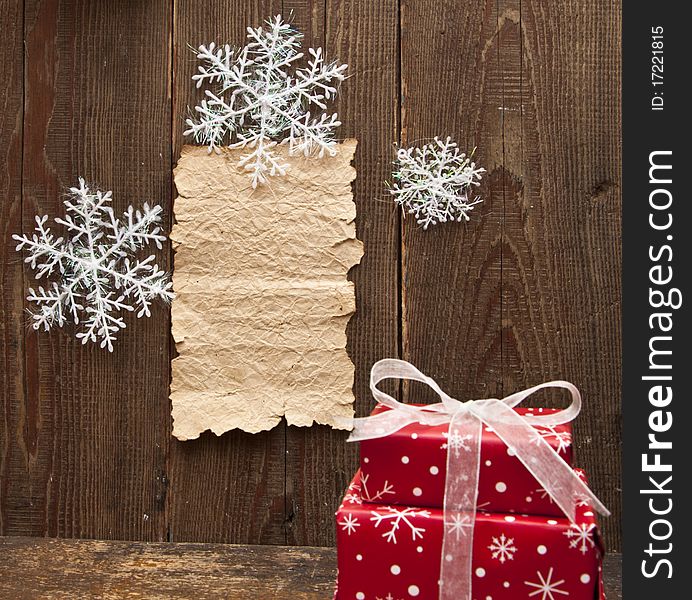 Christmas decoration and old paper on brown wood texture