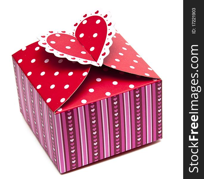 Red gift box and hearts on white background