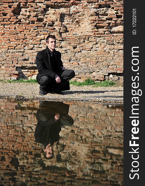 Portrait of an attractive man reflected in the lake. Portrait of an attractive man reflected in the lake