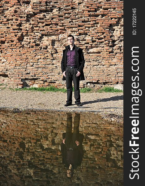 Portrait of an attractive man reflected in the lake. Portrait of an attractive man reflected in the lake