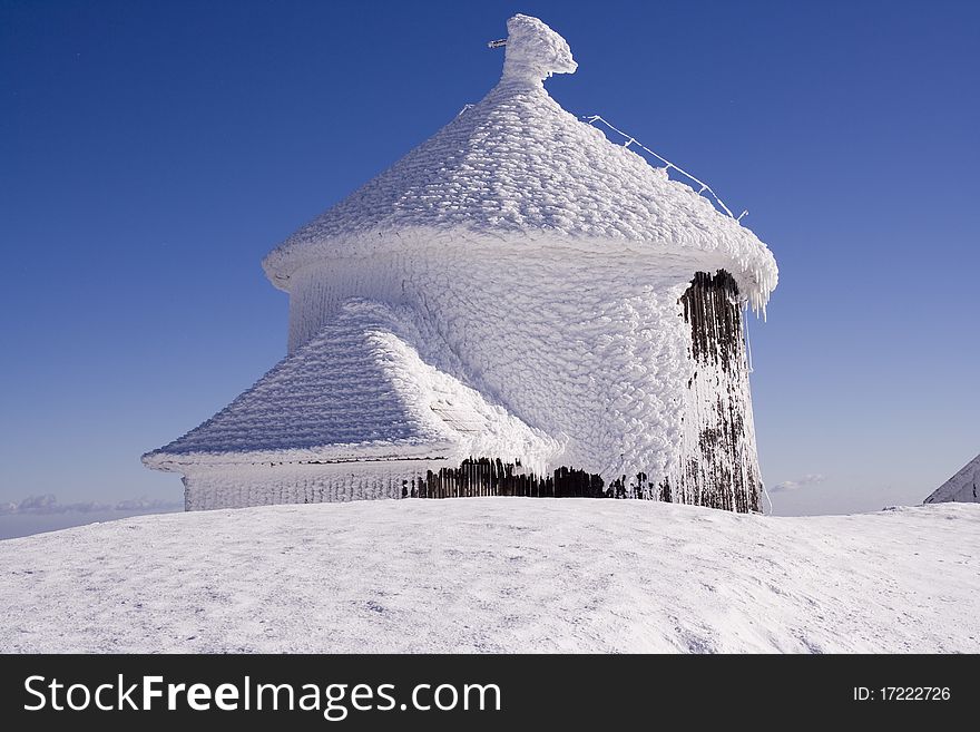 Small chapel on a summit during blizzard. Small chapel on a summit during blizzard