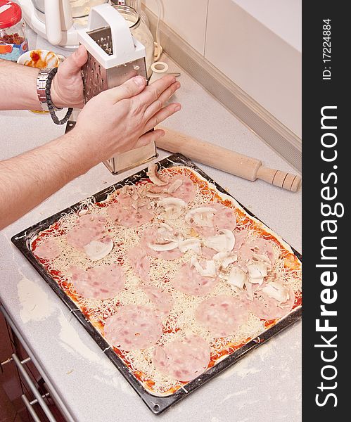 Preparing pizza in a pizzeria