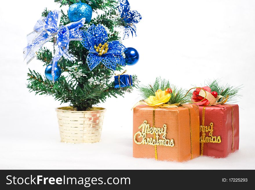 Two gift boxes with a christmas tree isolated on white