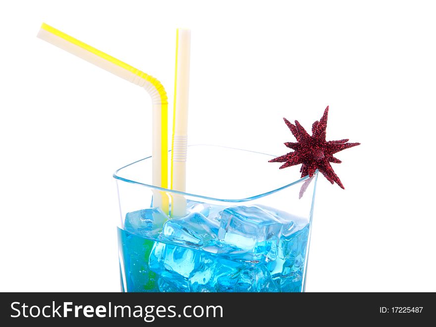 Blue Hawaiian Cocktails with vodka, light rum, gin, tequila, blue curacao, lime juice, lemonade, two yellow striped strawsand christmas star isolated on a white background