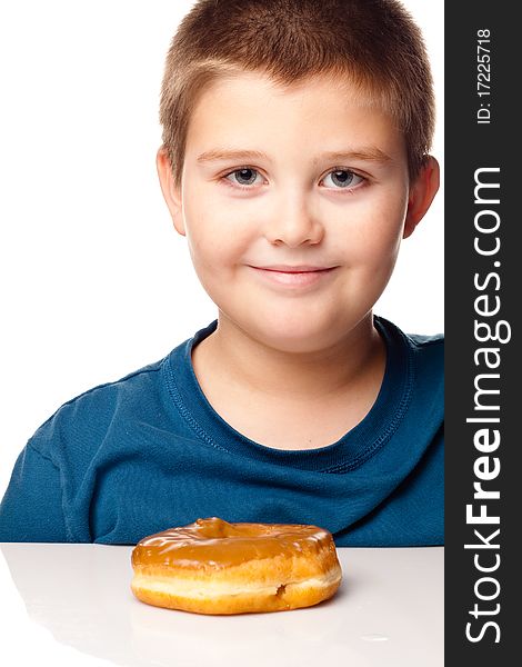 Boy about to eat a donut. Boy about to eat a donut