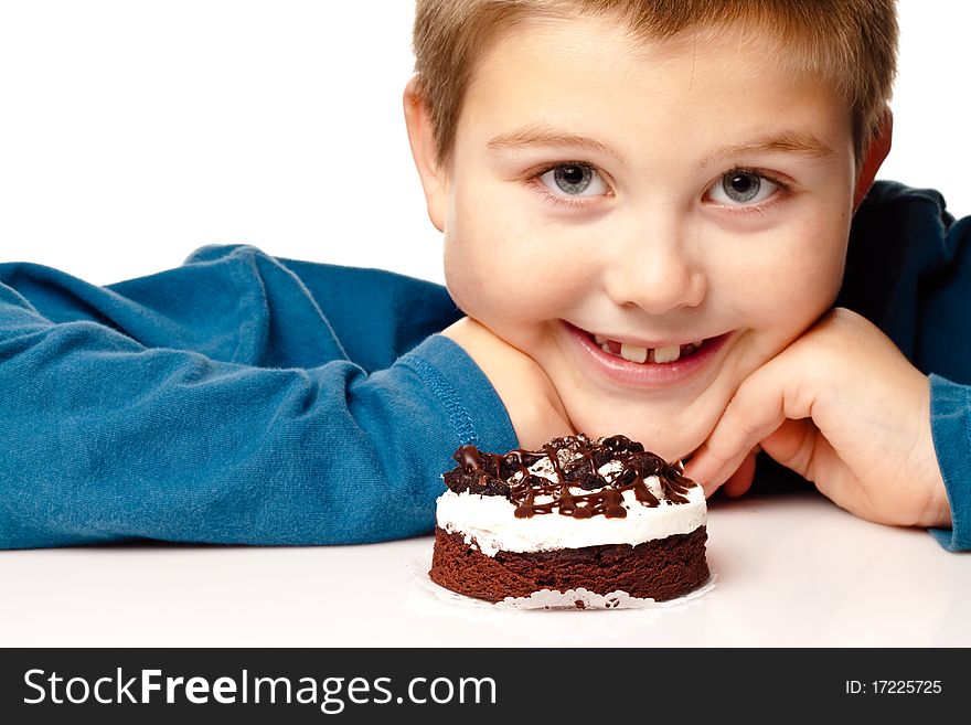 Young Boy Deciding To Eat Dessert