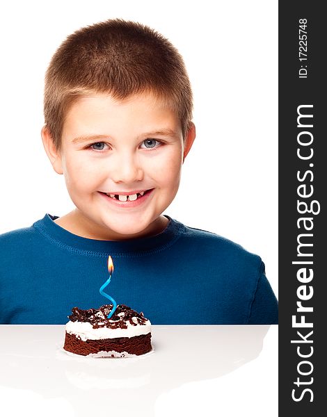 Young boy deciding to eat a dessert