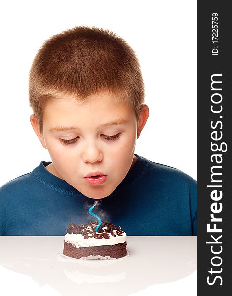 Young Boy deciding to eat a dessert and making a wish