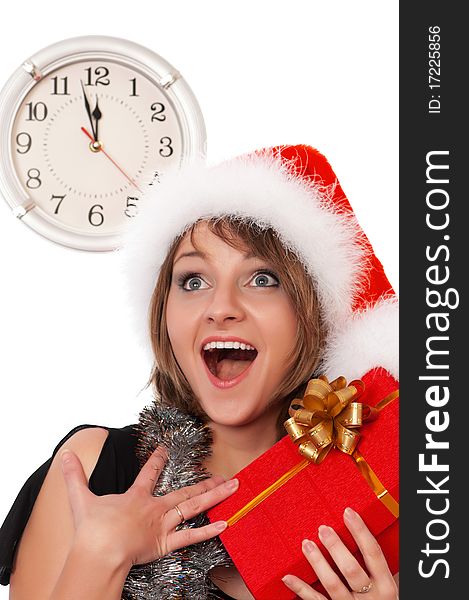 Emotional beautiful christmas girl holding gift wearing Santa hat