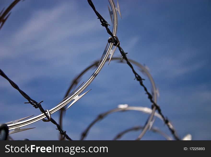 Barbed Wire Against a Blue Sky