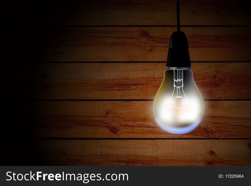 Image of Light bulb over wooden background