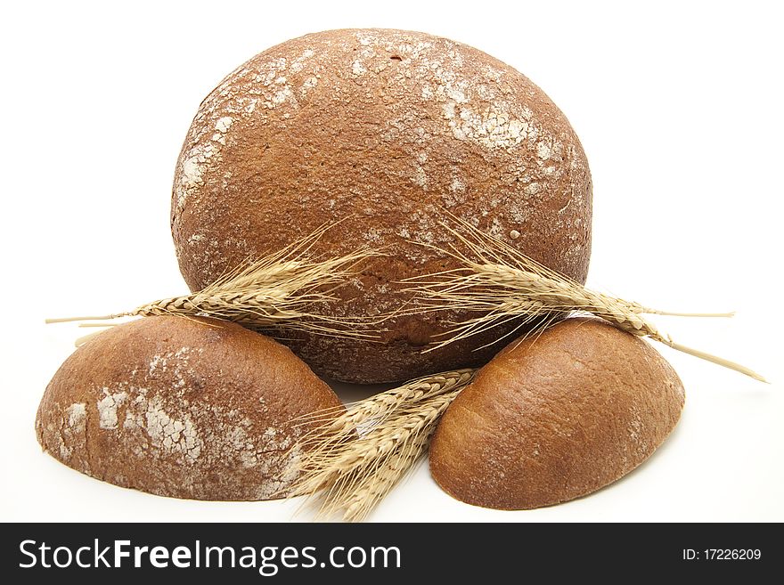 Round bread cut with wheat ears