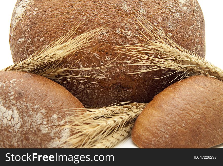 Round bread cut with wheat ears