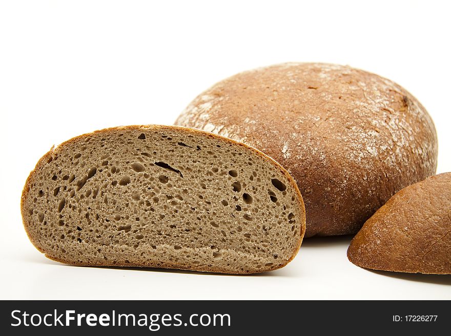 Round bread cut onto white background