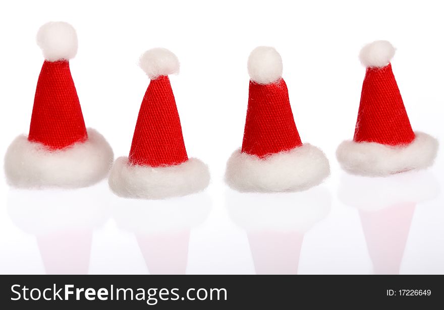 New Year: Four Small Santas Caps