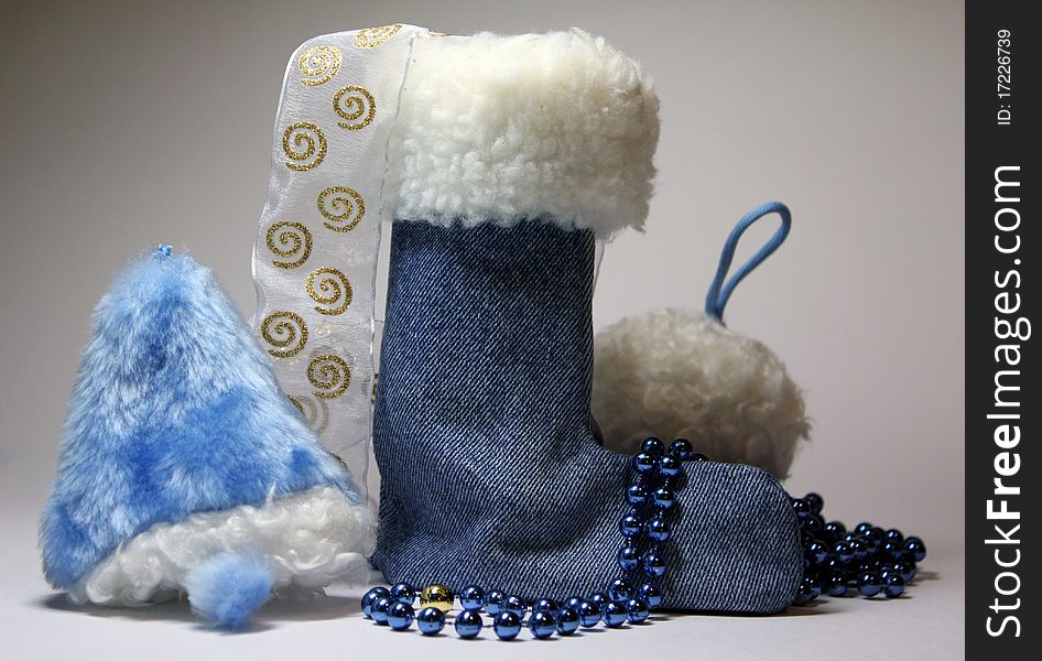 Festive set of objects bell boots and snow