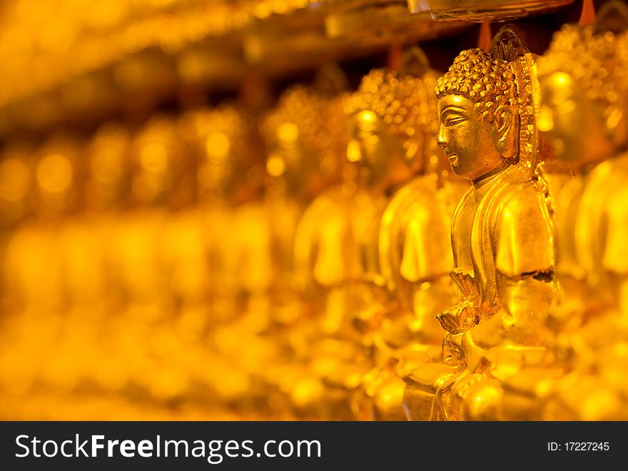 Buddha, many stuck to the wall a Chinese temple in Thailand. Buddha, many stuck to the wall a Chinese temple in Thailand