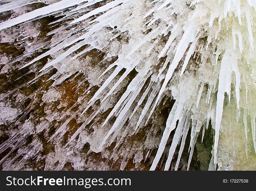 The dangerous icicles which have frozen on coastal Baikal rocks