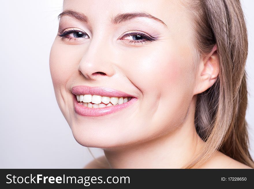 Attractive happy young woman portrait on white background