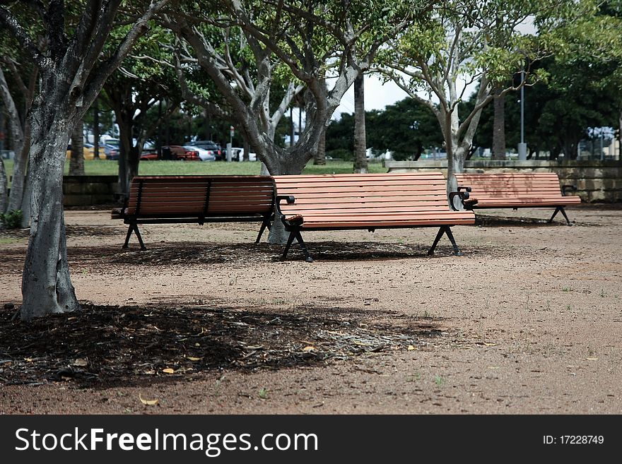 Three park bench seats in outdoors park