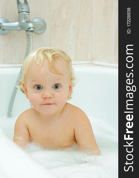 Little boy in bath with water and foam. Little boy in bath with water and foam