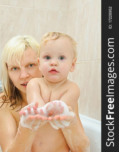 Mother and her son in the bathroom. Mother and her son in the bathroom