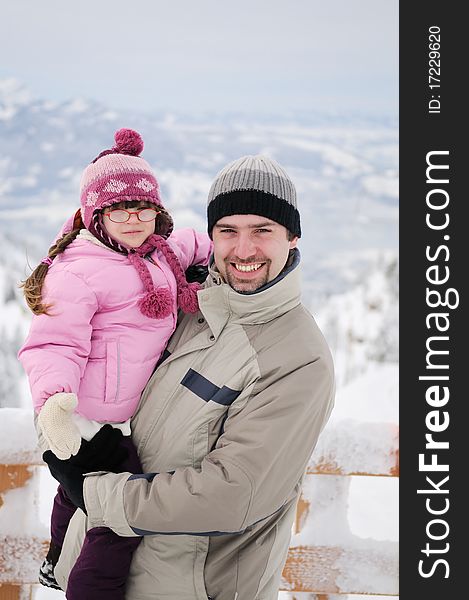 Young Father And His Daughter In Mountains