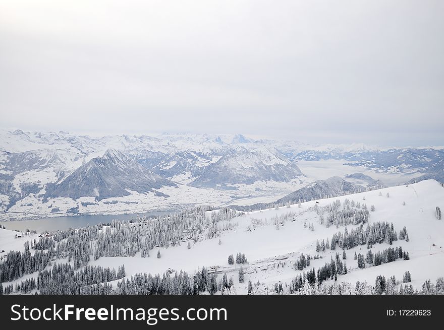 Winter view of Alps and mountain lake in Switzerland. Winter view of Alps and mountain lake in Switzerland