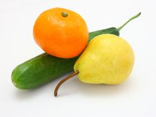 Cucumber With A Tangerine And A Pear Royalty Free Stock Photos Cucumber With A Tangerine And A Pear Royalty Free Stock Photos