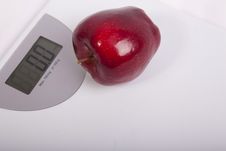 Body Weighing Scales And A Red Apple. Stock Image