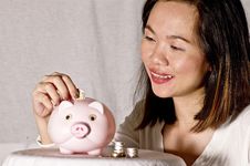 Young Woman With Pink Piggy Bank Stock Image