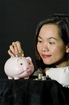 Young Woman With Pink Piggy Bank Royalty Free Stock Image