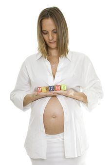 Beautiful Pregnant Woman Holding Baby Blocks Stock Photos