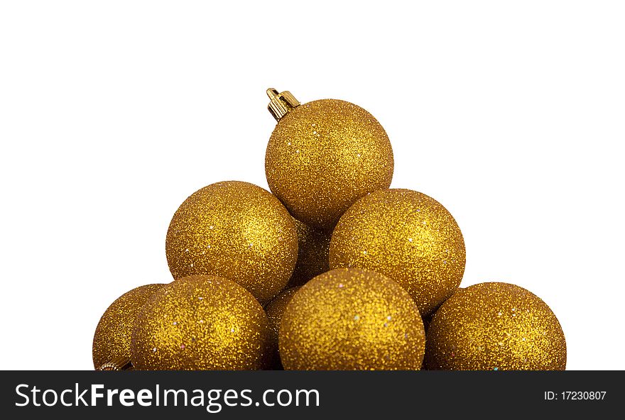 Pyramid of golden Christmas balls isolated on white