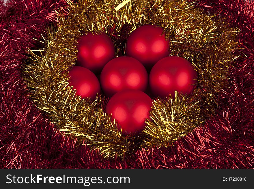 Set or red Christmas balls in a shower or sparks