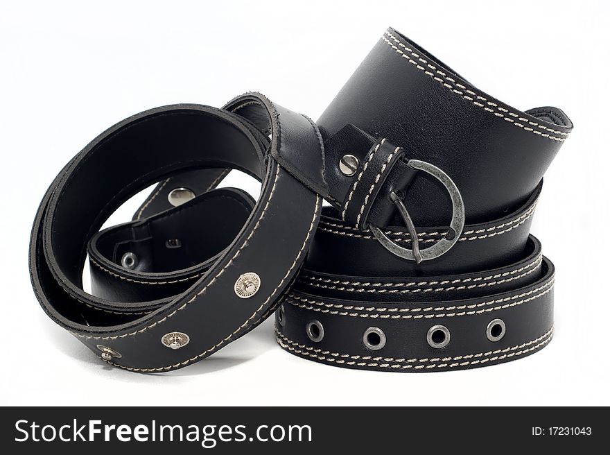 Black womens leather belts with buckle on a white background. Black womens leather belts with buckle on a white background