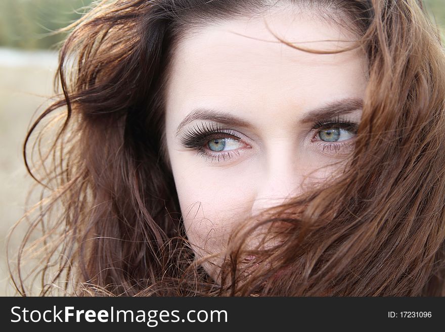 Expressing eyes of young woman with beautiful make-up