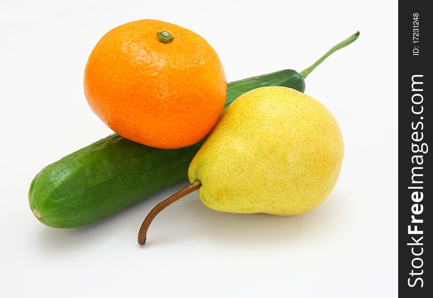 Cucumber with a tangerine and a pear