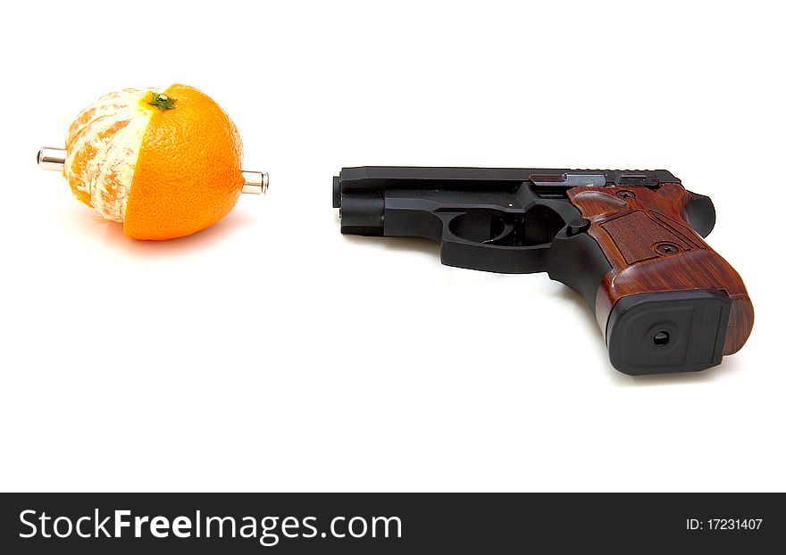 The close up of a pistol  Rakes a tangerine is isolated on a white background. The close up of a pistol  Rakes a tangerine is isolated on a white background