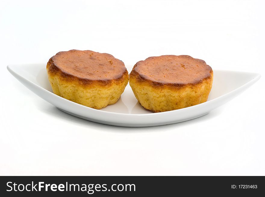 Delicious wheat muffins sweet tasty on a white background closeup. Delicious wheat muffins sweet tasty on a white background closeup