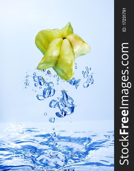Close up of water splash with star fruit