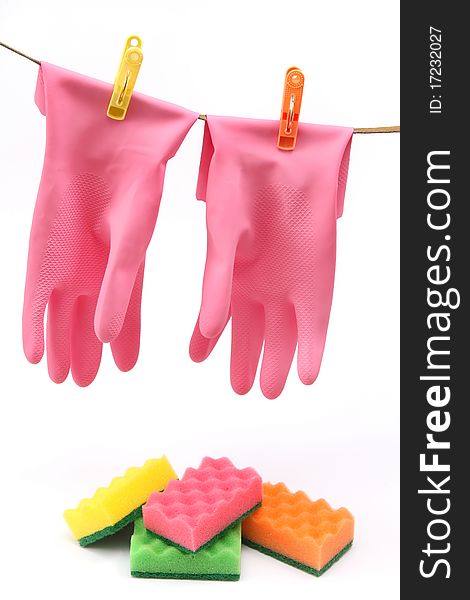 Things for cleaning - colorful protective gloves and sponges. Things for cleaning - colorful protective gloves and sponges