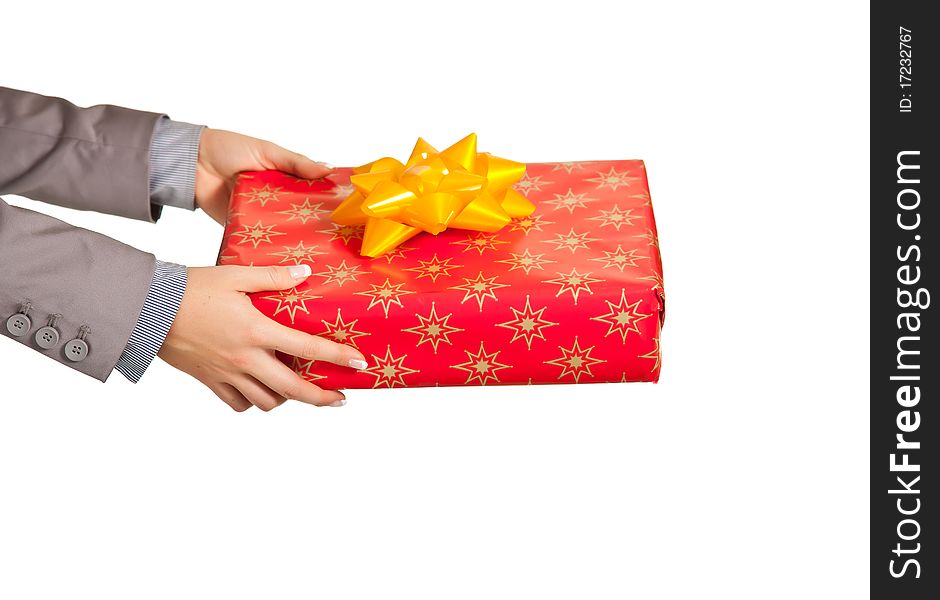 Woman hand holding christmas present on white background